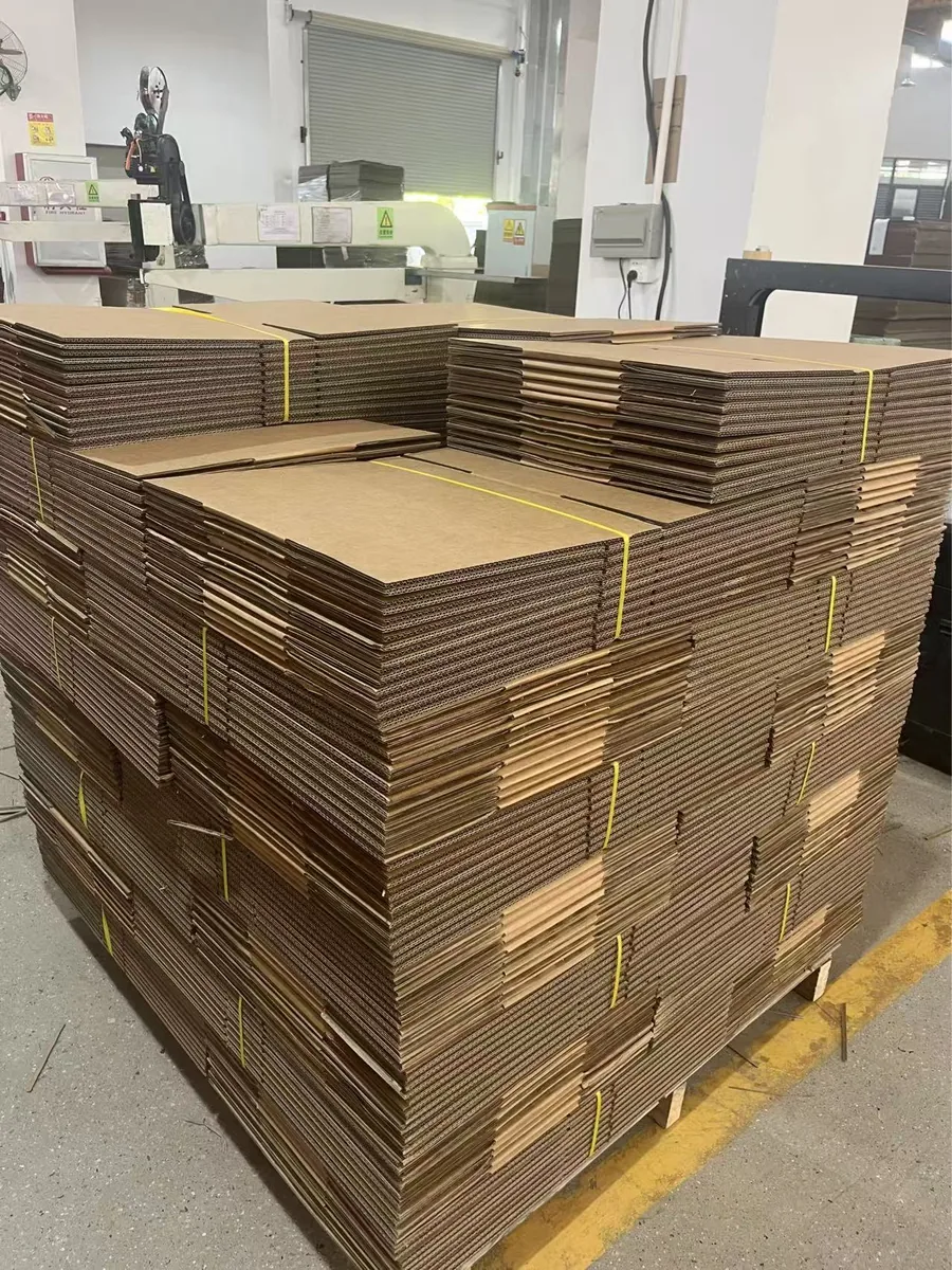 Bulk corrugated box blanks stacked for custom packaging production